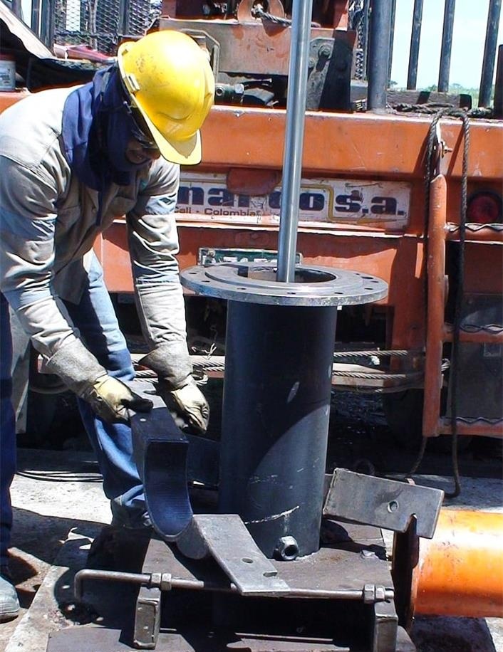 Technician working beside industrial machinery during installation